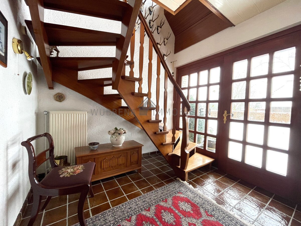 VERKAUFT! Ausgebauter Bungalow mit Wintergarten und Bootssteg in Kanallage von Osterhusen