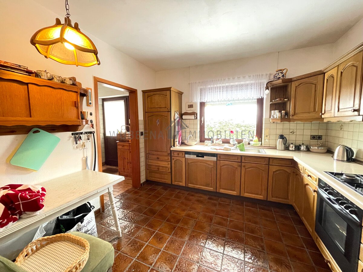 VERKAUFT! Ausgebauter Bungalow mit Wintergarten und Bootssteg in Kanallage von Osterhusen