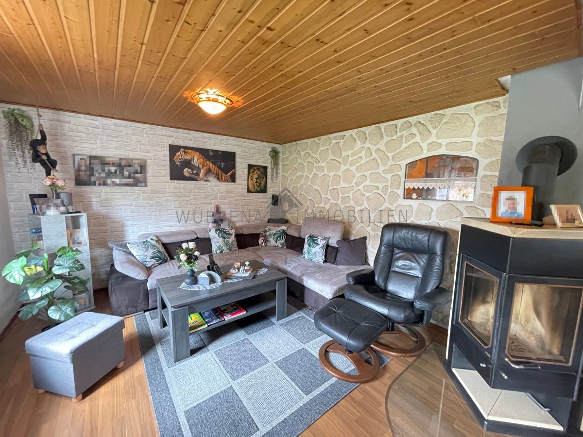 Wohnzimmer mit Kamin EG Wohnzimmer mit Kamin EG